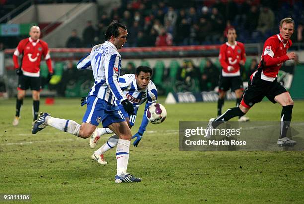 Theofanis Gekas of Berlin scores his team's third goal during the Bundesliga match between Hannover 96 and Hertha BSC Berlin at the AWD Arena on...