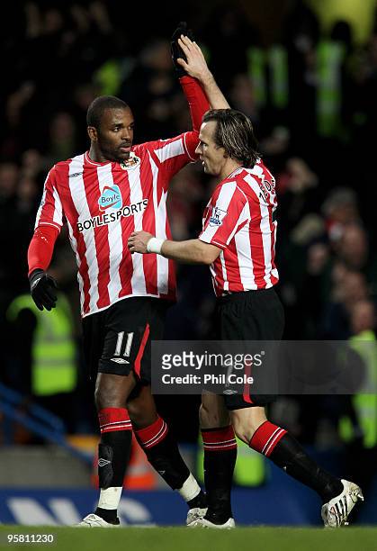 Bolo Zenden of Sunderland is congratulated by teammate Darren Bent after scoring his team'sopening goal during the Barclays Premier League match...