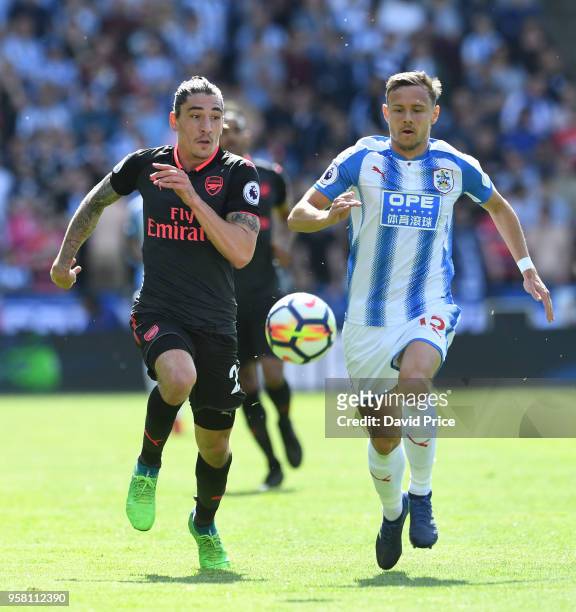 Hector Bellerin of Arsenal takes on Chris Lowe of Huddersfield during the Premier League match between Huddersfield Town and Arsenal at John Smith's...