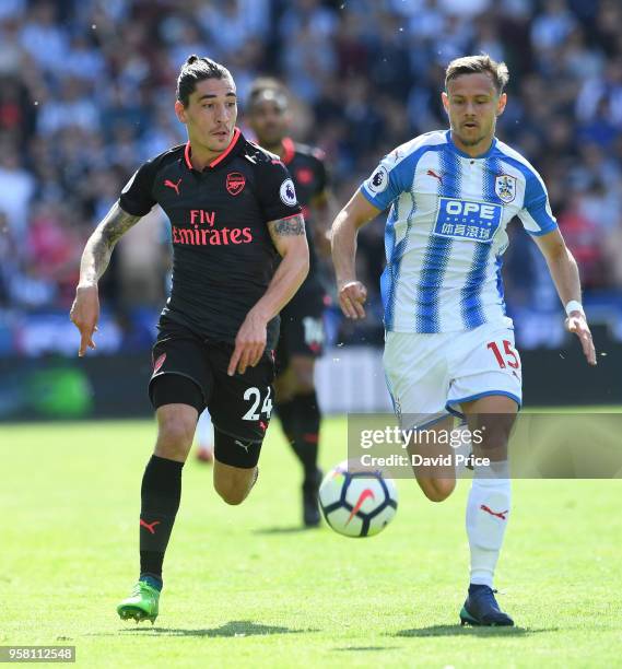 Hector Bellerin of Arsenal takes on Chris Lowe of Huddersfield during the Premier League match between Huddersfield Town and Arsenal at John Smith's...