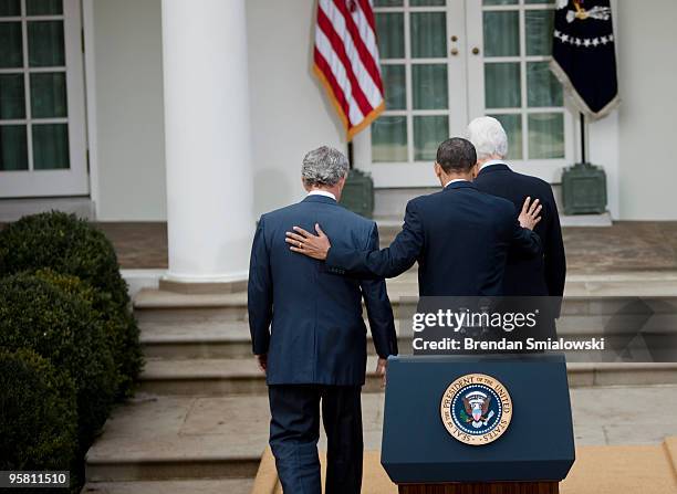 President Barack Obama , former President Bill Clinton and former President George W. Bush walk away after holding a press conference in the Rose...