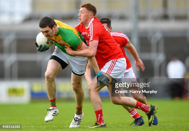 Laois , Ireland - 13 May 2018; Conor Lawlor of Carlow in action against Ryan Burns of Louth during the Leinster GAA Football Senior Championship...