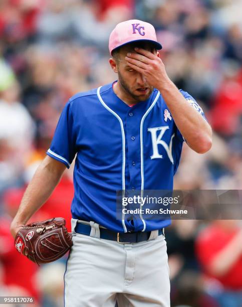 Starting pitcher Danny Duffy of the Kansas City Royals reacts after giving up a three run home run to Jose Ramirez of the Cleveland Indians during...