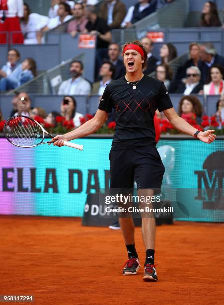 Alexander Zverev of Germany celebrates match point against Dominic Thiem of Austria in the mens final during day nine of the Mutua Madrid Open tennis...