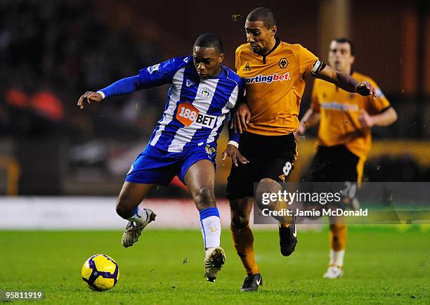 Charles N'Zogbia of Wigan battles with Karl Henry of Wolves during the Barclays Premier League match between Wolverhampton Wanderers and Wigan...