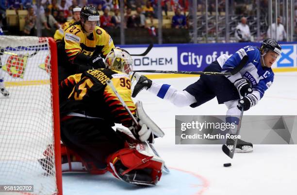 Mathias Niederberger, goaltender of Germany tends net against Mikael Granlund of Finland during the 2018 IIHF Ice Hockey World Championship Group B...