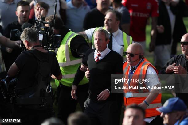 Lee Bowyer the head coach / manager of Charlton Athletic gets led off the pitch at the end of the game during the Sky Bet League One Play Off Semi...