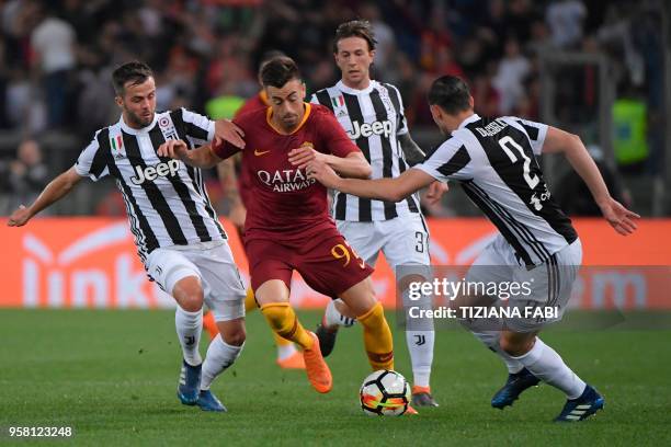 Roma's Italian striker Stephan El Shaarawy fights for the ball with Juventus midfielder from Italy Miralem Pjanic during the Italian Serie A football...