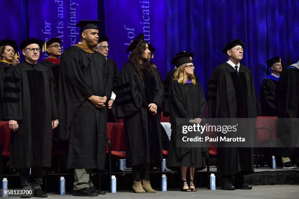 Tom Perrotta, Deeyah Khan and Billy Collins attend the Emerson College Undergaraduate Commencement Ceremony at Agganis Arena at Boston University on...