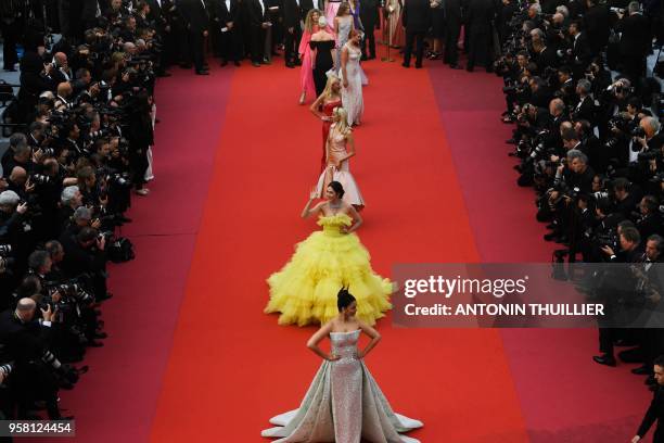 Indian actress and model Aishwarya Rai and British-Thai actress Araya Hargate pose as they arrive on May 13, 2018 for the screening of the film "Sink...