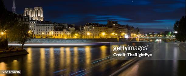 paris seine river dusk - bateau mouche stock pictures, royalty-free photos & images
