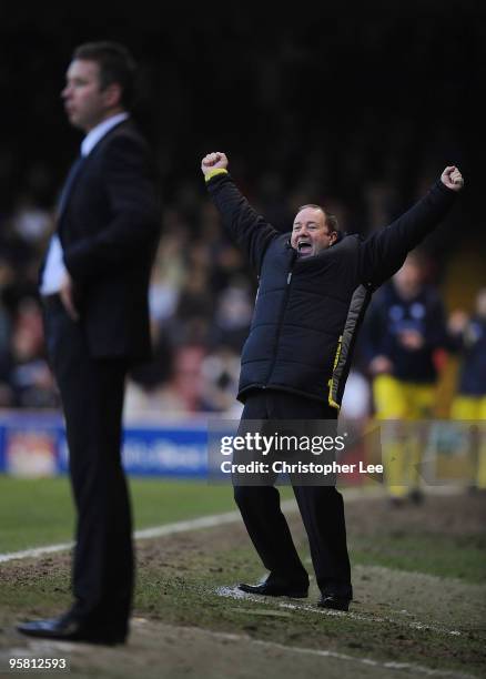 Manager Gary Johnson of Bristol celebrates their third goal as Darren Ferguson of Preston holds his face during the Coca-Cola Championship match...