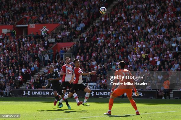 Gabriel Jesus of Manchester City lobs the ball over Alex McCarthy of Southampton to score the winning goal during the Premier League match between...