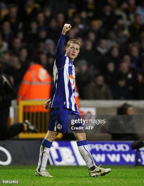 Wigan Athletic's Scottish midfielder James McCarthy celebrates scoring the first goal during the English Premier League football match between...