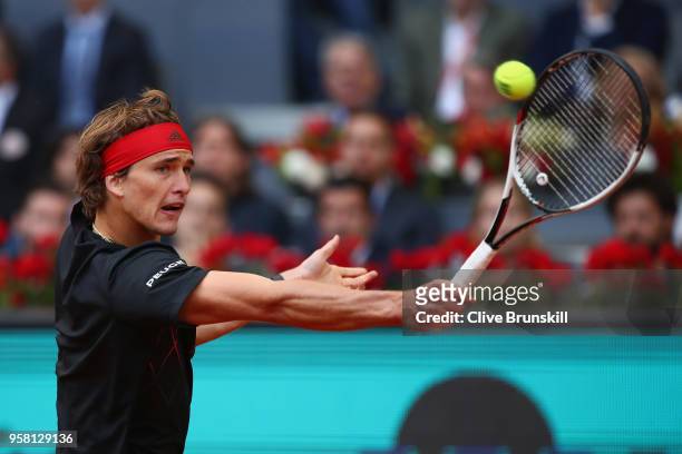 Alexander Zverev of Germany plays a backhand against Dominic Thiem of Austria in the mens final during day nine of the Mutua Madrid Open tennis...