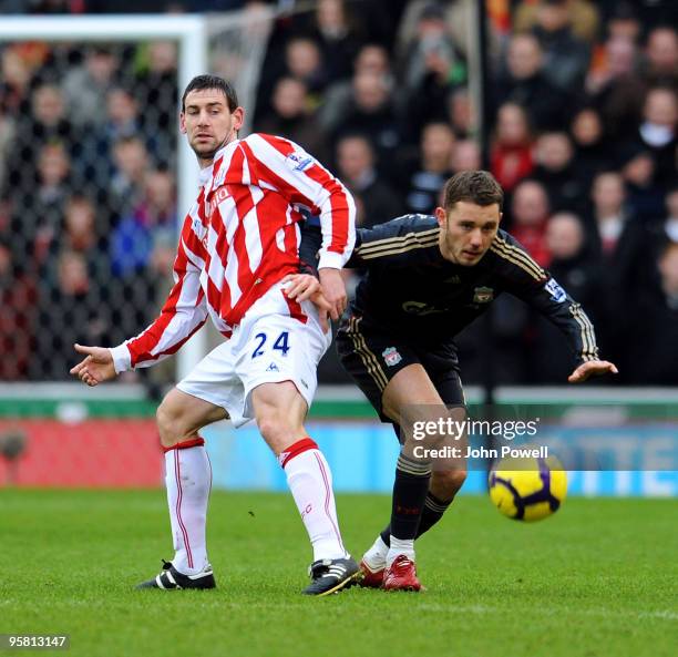 Fabio Aurelio of Liverpool competes with Rory Delap of Stoke during the Barclays Premier League match between Stoke City and Liverpool at Britannia...