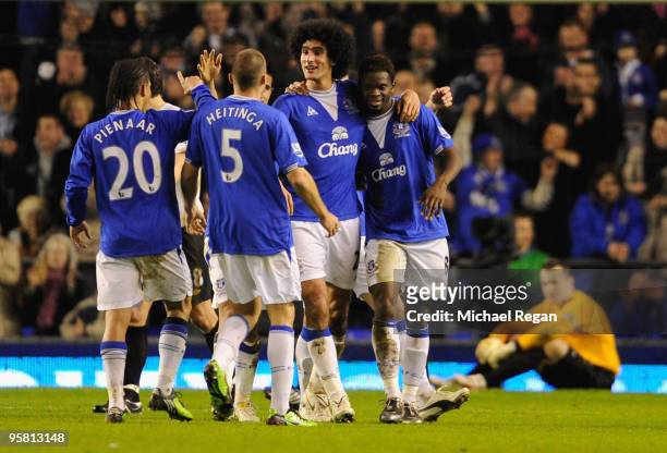 Louis Saha of Everton is congratulated by his team mates after scoring his team's second goal from a penalty during the Barclays Premier League match...