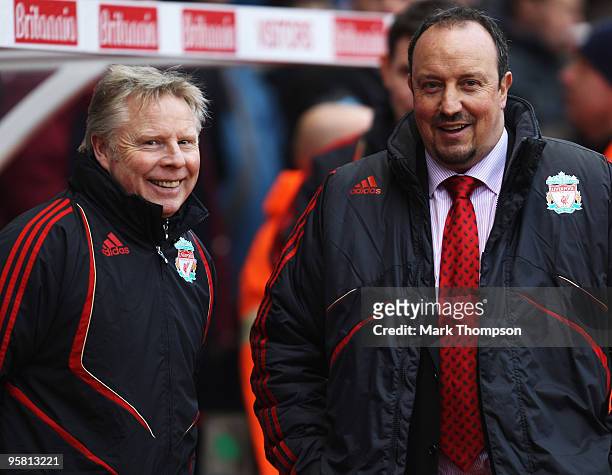 Rafael Benitez the manager of Liverpool laughs with his assistant Sammy Lee during the Barclays Premier League match between Stoke City and Liverpool...