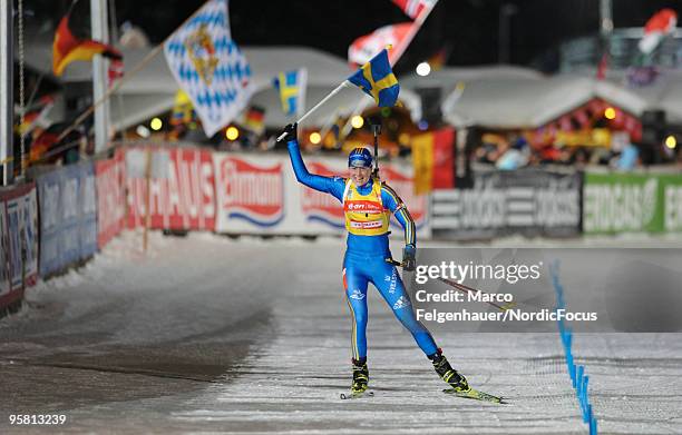 Helena Jonsson of Sweden celebrates during the women's mass start in the e.on Ruhrgas IBU Biathlon World Cup on January 16, 2010 in Ruhpolding,...