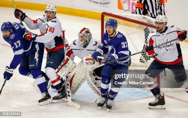 Goalie Braden Holtby of the Washington Capitals, center, is between, from left, Alex Killorn of the Tampa Bay Lightning, Jay Beagle of the Washington...