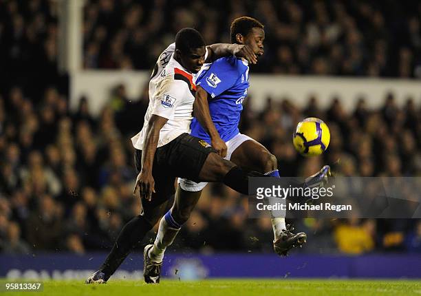 Micah Richards of Manchester City challenges Louis Saha of Everton during the Barclays Premier League match between Everton and Manchester City at...