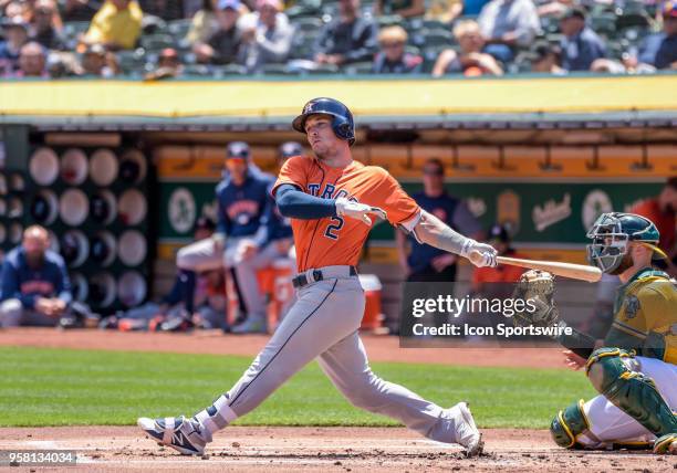 Houston Astros Third base Alex Bregman follows through with a hit to left field during the game between the Houston Astros vs Oakland Athletics on...