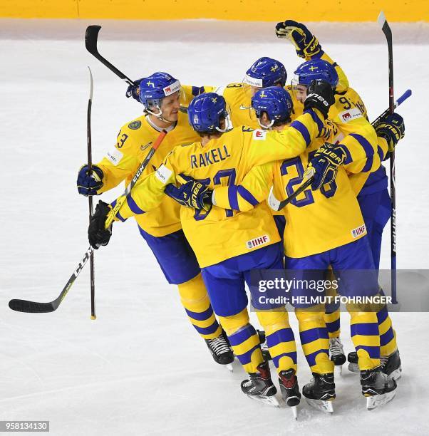 Sweden's players celebrate after scoring during the group A match Switzerland vs Sweden of the 2018 IIHF Ice Hockey World Championship at the Royal...