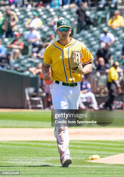 Oakland Athletics Outfield Stephen Piscotty comes in from right field after making a diving catch during the game between the Houston Astros vs...