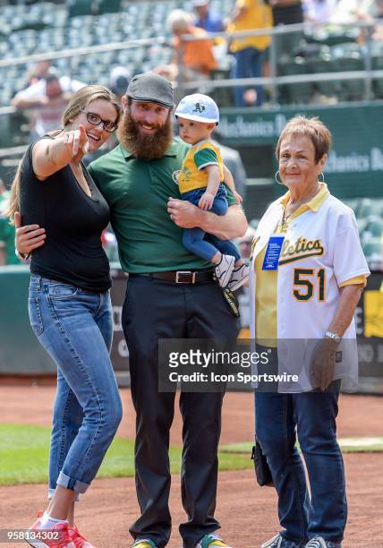 Dallas Braden, On-field analyst for NBC Sports, CA poses with his wife Meg, grandmother Peggy Lindsey and daughter Kinsley Jo before the game between...
