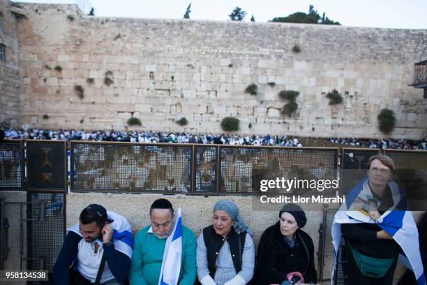 Israelis wave their national flags during a march at the Western Wall on May 13, 2018 in Jerusalem, Israel. Israel mark Jerusalem Day celebrations...