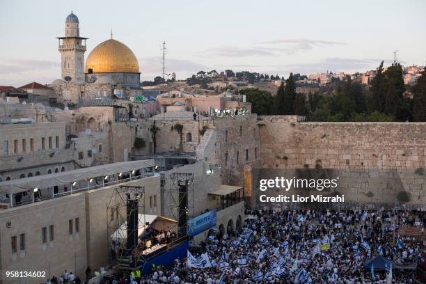 Israelis wave their national flags during a march at the Western Wall on May 13, 2018 in Jerusalem, Israel. Israel mark Jerusalem Day celebrations...