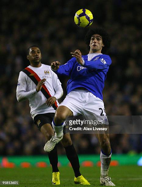 Marouane Fellaini of Everton beats Robinho of Manchester City to the ball during the Barclays Premier League match between Everton and Manchester...