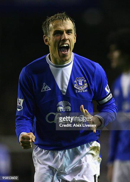 Phillip Neville of Everton celebrates victory at the end of the Barclays Premier League match between Everton and Manchester City at Goodison Park on...