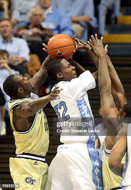 Andre Bell of the Georgia Tech Yellow Jackets blocks Ed Davis of the North Carolina Tar Heels during their game at the Dean Smith Center on January...