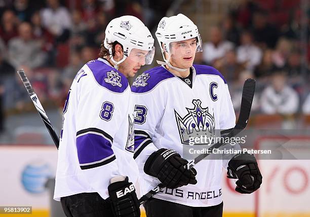 Drew Doughty and Dustin Brown of the Los Angeles Kings talk during the NHL game against the Phoenix Coyotes at Jobing.com Arena on December 26, 2009...