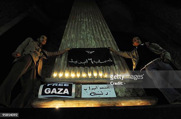 Egyptian prostesters from the "April 6 Movement" hold a banner during a demonstration against the blockade of the Gaza Strip in downtown Cairo on...