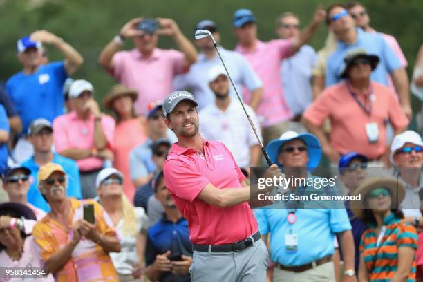 Webb Simpson of the United States plays his shot from the third tee during the final round of THE PLAYERS Championship on the Stadium Course at TPC...