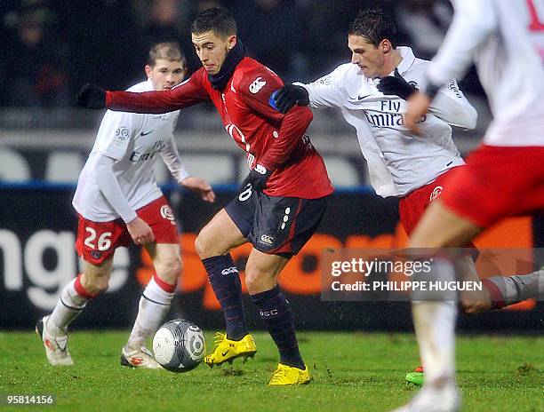 Lille's Belgian midfielder Eden Hazard vies with Paris' midfielder Christophe Jallet during the French L1 football match Lille vs. PSG on January 16,...