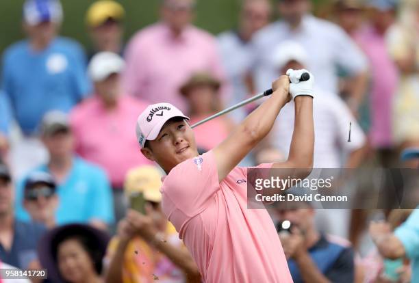Danny Lee of New Zealand plays his tee shot on the par 3, third hole during the final round of the THE PLAYERS Championship on the Stadium Course at...