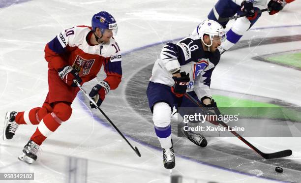 Roman Cervenka of Czech Republic in action with Yohann Auvitu of France during the 2018 IIHF Ice Hockey World Championship Group A between France and...