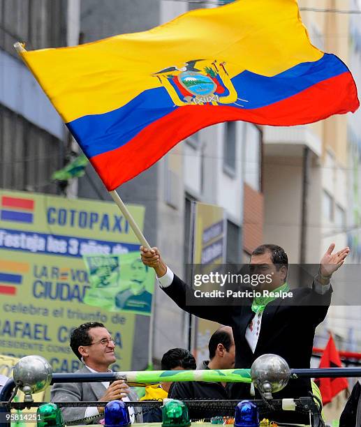 President of Ecuador Rafael Correa waves to population during a gathering to celebrate three years of government on January 16, 2010 in Quito,...