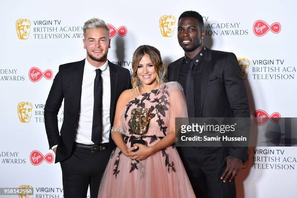 Chris Hughes, Caroline Flack and Marcel Somerville pose with the BAFTA for Best Reality and Constructed Factual show in the press room during the...