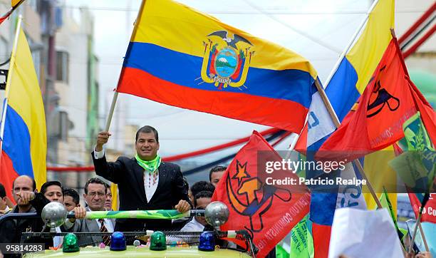 President of Ecuador Rafael Correa waves to population during a gathering to celebrate three years of government on January 16, 2010 in Quito,...