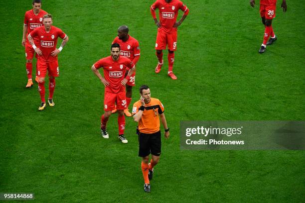 Renaud Emond forward of Standard Liege, Pedro Luis Cavanda midfielder of Standard Liege, Konstantinos Laifis defender of Standard Liege - referee Van...