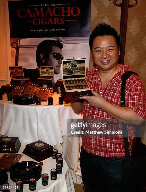 Actor Rex Lee poses with the Camacho Cigars display during the HBO Luxury Lounge in honor of the 67th annual Golden Globe Awards held at the Four...