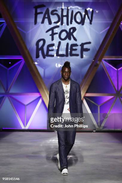 Mario Balotelli walks the Runway at Fashion for Relief Cannes 2018 during the 71st annual Cannes Film Festival at Aeroport Cannes Mandelieu on May...