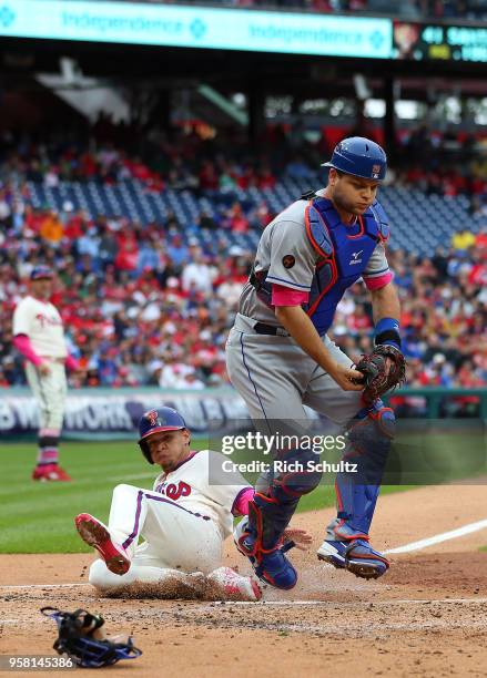 Catcher Devin Mesoraco of the New York Mets gets the force out on Cesar Hernandez of the Philadelphia Phillies on a ground ball hit by Carlos Santana...
