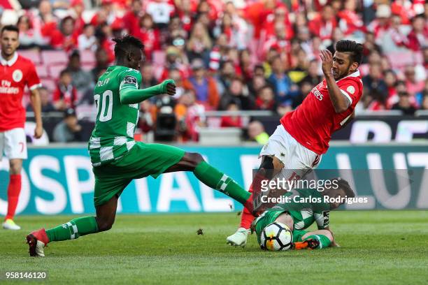 Benfica forward Toto Salvio from Argentina tackled by Moreirense FC forward Toze from Portugal and Moreirense FC midfielder Alfa Semedo from Guine...