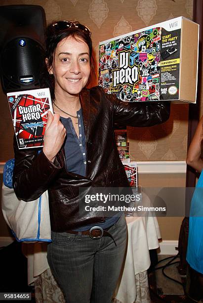 Actress Jane Adams poses with the Activision display during the HBO Luxury Lounge in honor of the 67th annual Golden Globe Awards held at the Four...