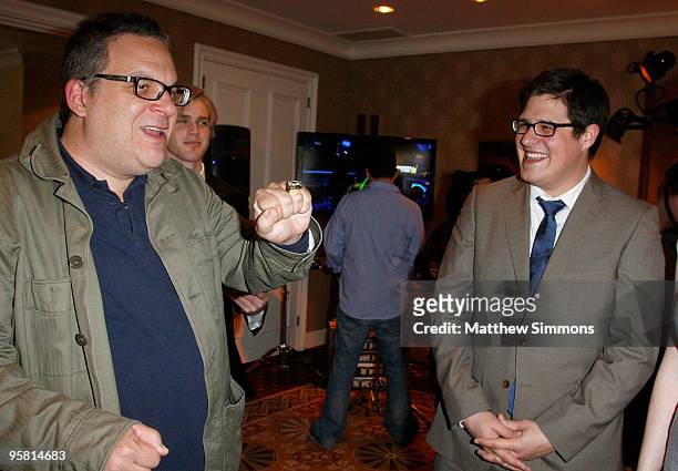 Actor Jeff Garlin and Rich Sommer talk near the Activision display during the HBO Luxury Lounge in honor of the 67th annual Golden Globe Awards held...